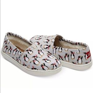 Toms Penguin slip on slides.